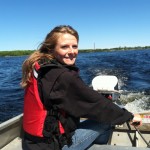 Volunteer leader Xavier Donajkowski steering the boat out onto Lake Independence to collect water quality information in 2014.