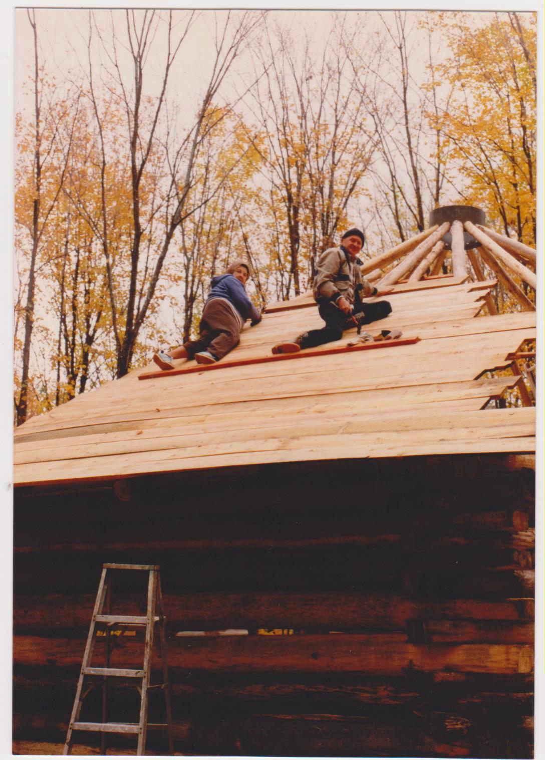 Rochelle Dale's Aunt Mildred and her dad nailing down the boards on the Zender and Dale home roof in the Yellow Dog Watershed.