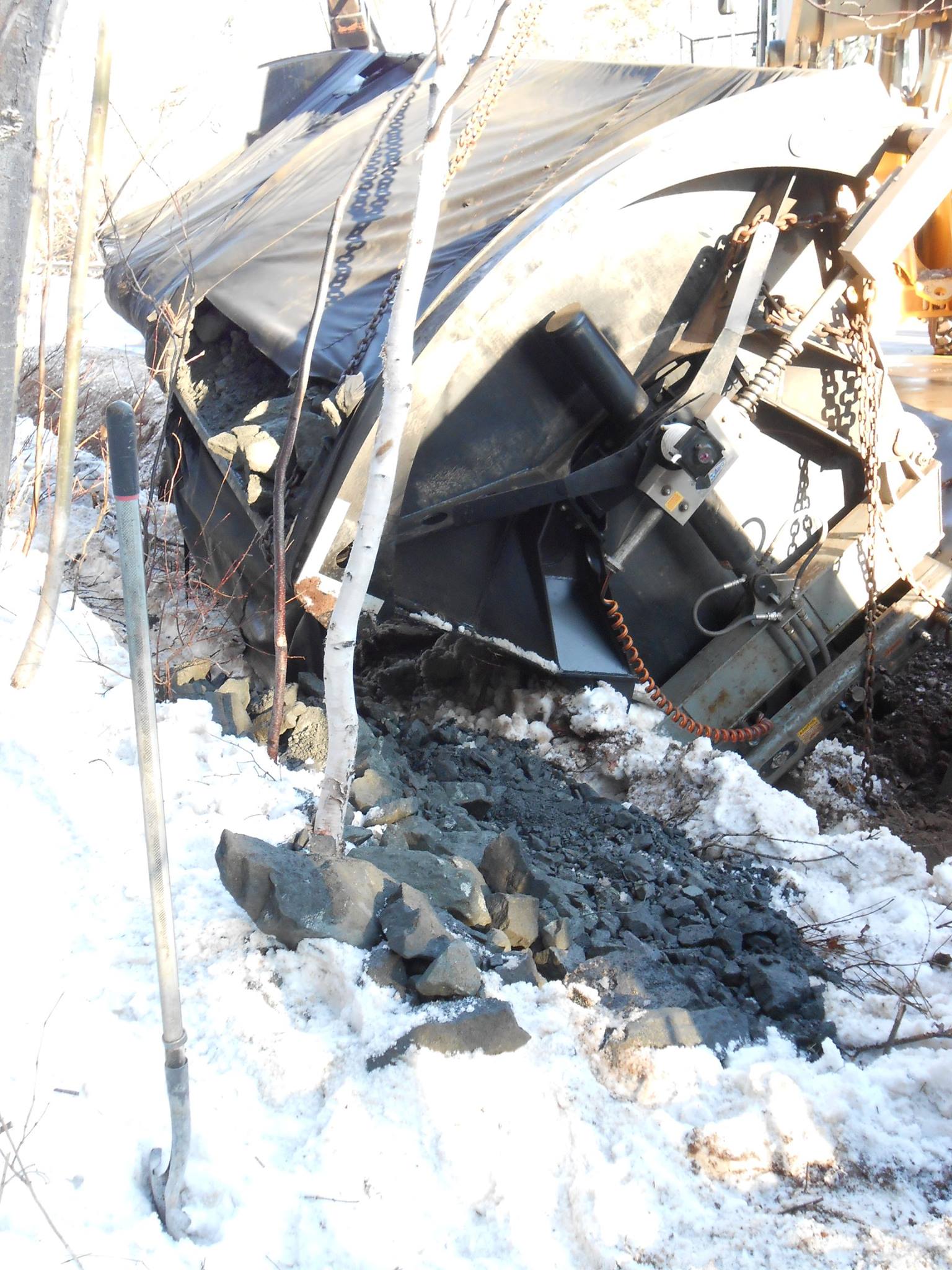 Ore spilled on the ground during the accident.