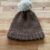 Brown winter hat with white pom pom (child)